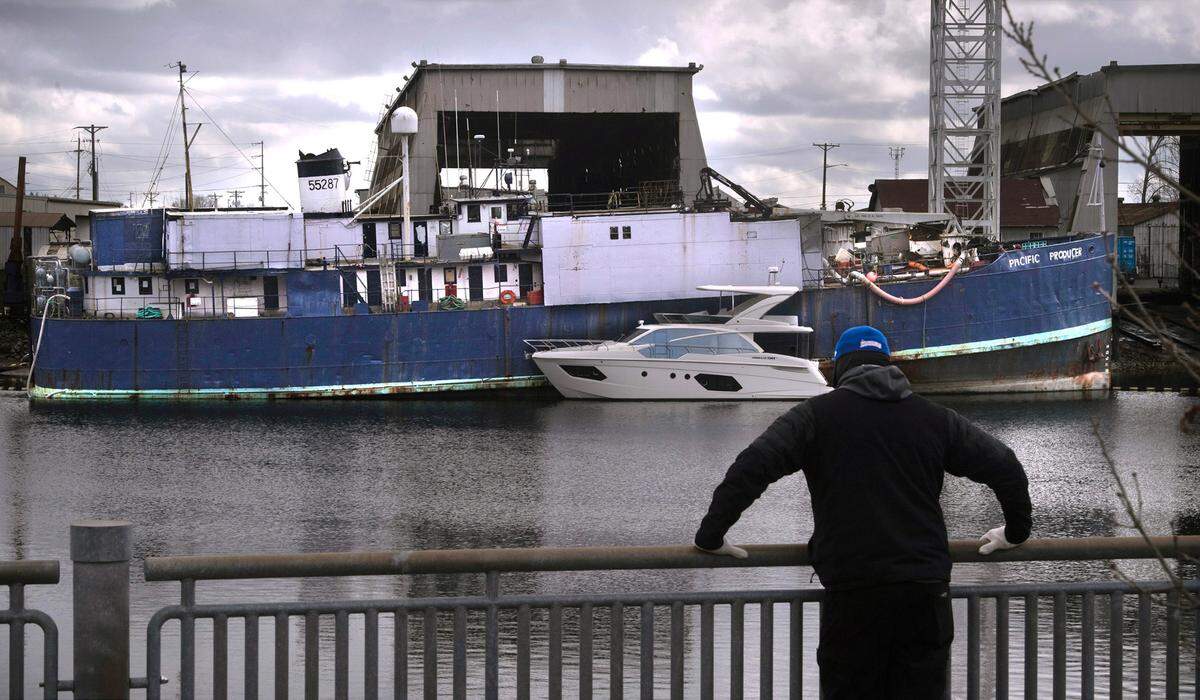 The Pacific Producer, a large fishing vessel, has been tied up at the old Martinac shipyards on the Thea Foss Waterway in Tacoma, Washington, shown on Tuesday, April 4, 2023. The ship is 77 years old, nearly 200 feet long, and has a history of environmental and safety concerns and fines.