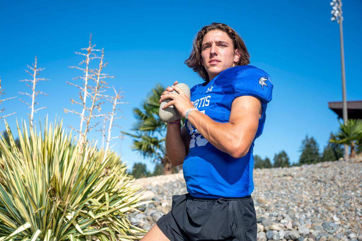 Curtis quarterback Rocco Koch poses for a portrait outside the stadium at Curtis High School on Wednesday, Sept. 7, 2022, in University Place, Wash.