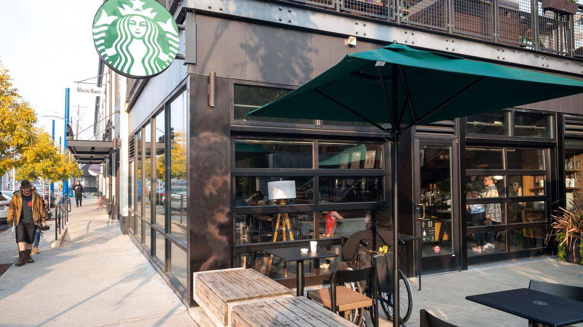 A Starbucks patron enjoys the patio on Wednesday, Oct. 19, 2022, in the Stadium District of Tacoma, Wash. The Starbucks location at 640 N. 1st St. will see its last day of operation Oct. 20, according to the company.