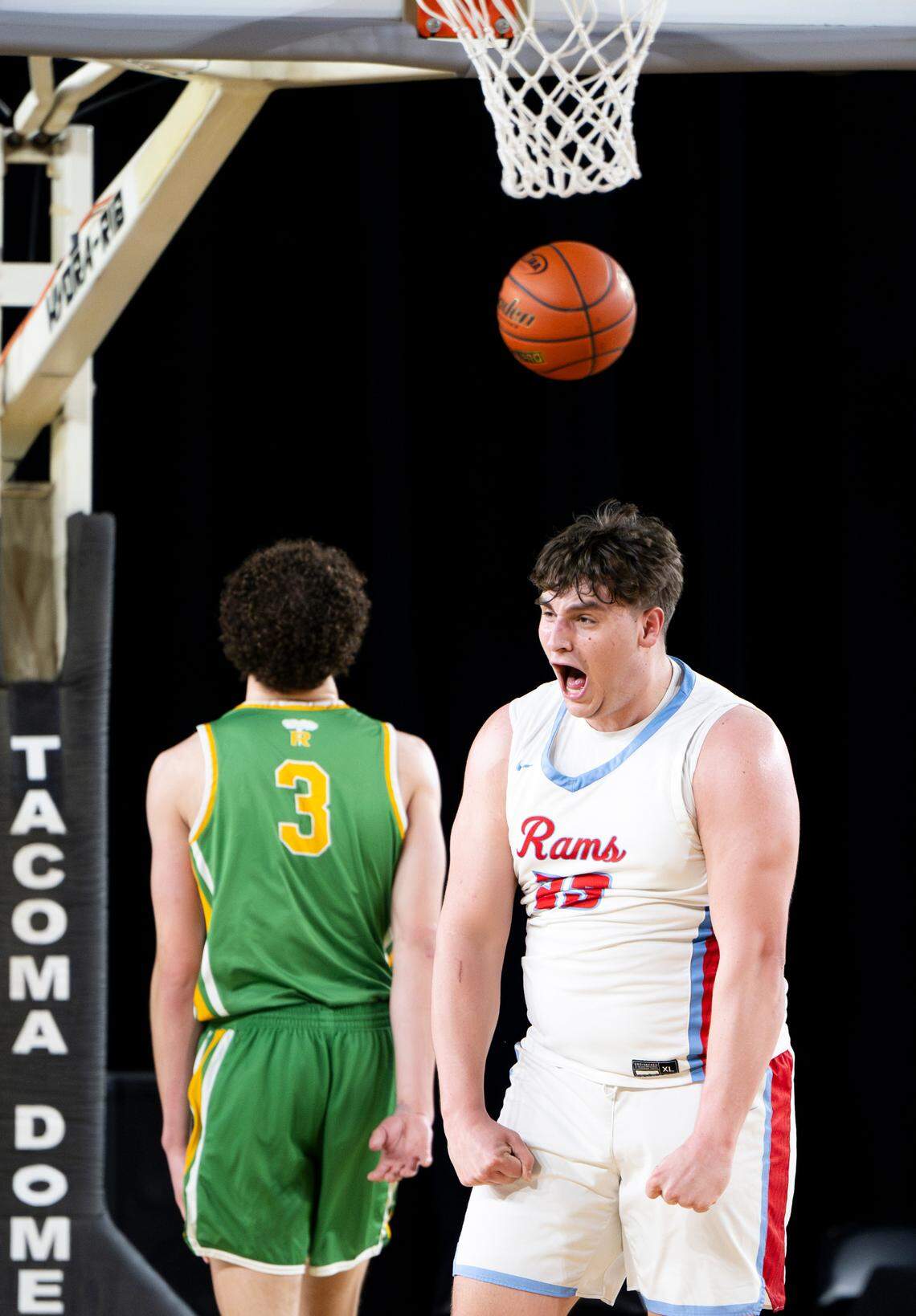 West Valley’s Parker Mills (23) reacts to a contested basket against Richland during the first half of a Class 4A state basketball tournament quarterfinal game at the Tacoma Dome on Thursday, March 6, 2025, in Tacoma.