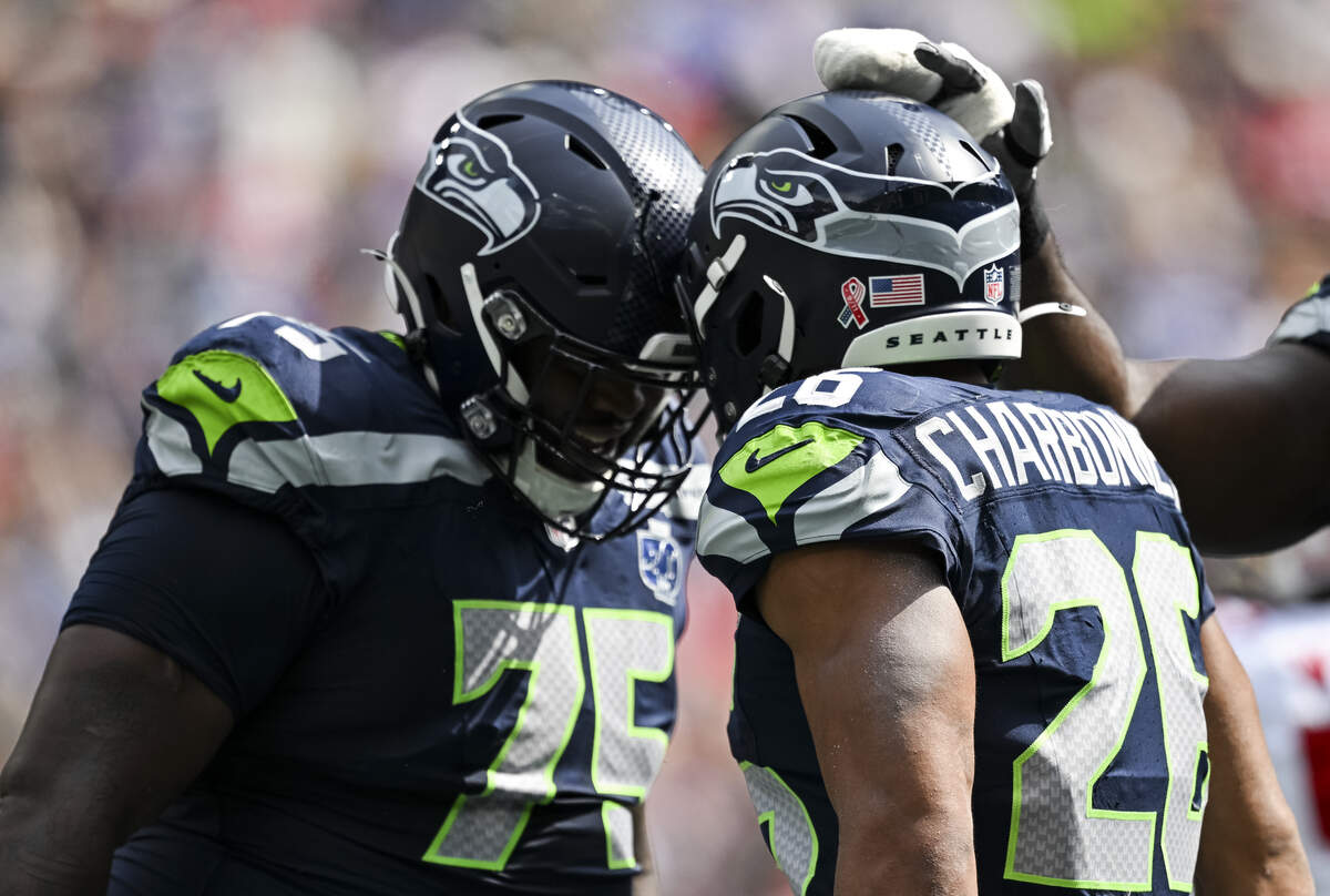 Seattle Seahawks running back Zach Charbonnet (26) celebrates the first touchdown during the second quarter of the game at Lumen Field, on Sunday, Sept. 7, 2025, in Seattle.