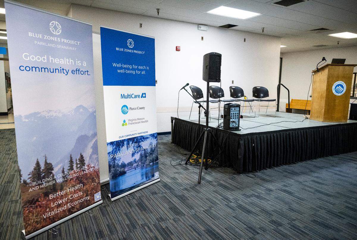Signs about Blue Zones Project, a collaboration of the local health care systems and Pierce County to improve health outcomes for residents in Parkland and Spanaway, stand in a room in the Sprinker Recreation Center on Dec. 12, 2022.