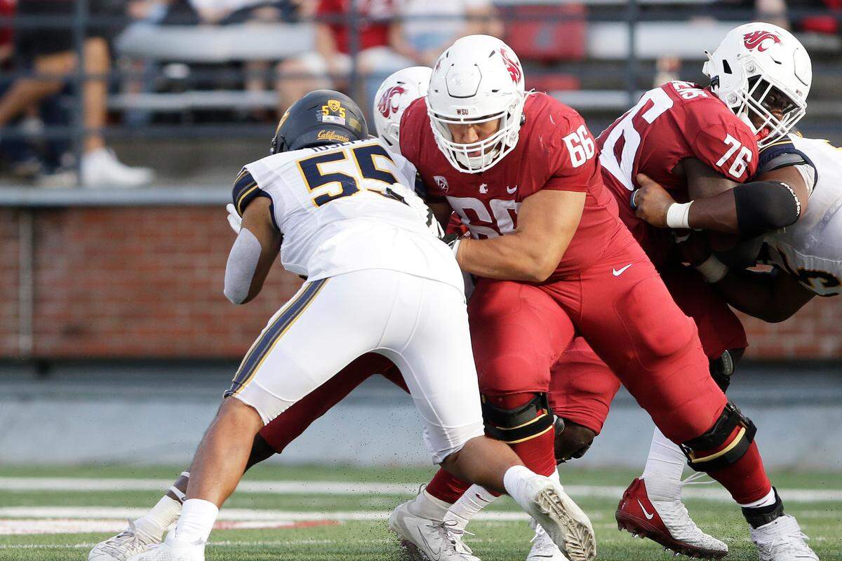 Washington State offensive lineman Ma’ake Fifita (66) blocks California linebacker Muelu Iosefa (55) during the second half of an NCAA college football game, Saturday, Oct. 1, 2022, in Pullman, Wash. (AP Photo/Young Kwak)