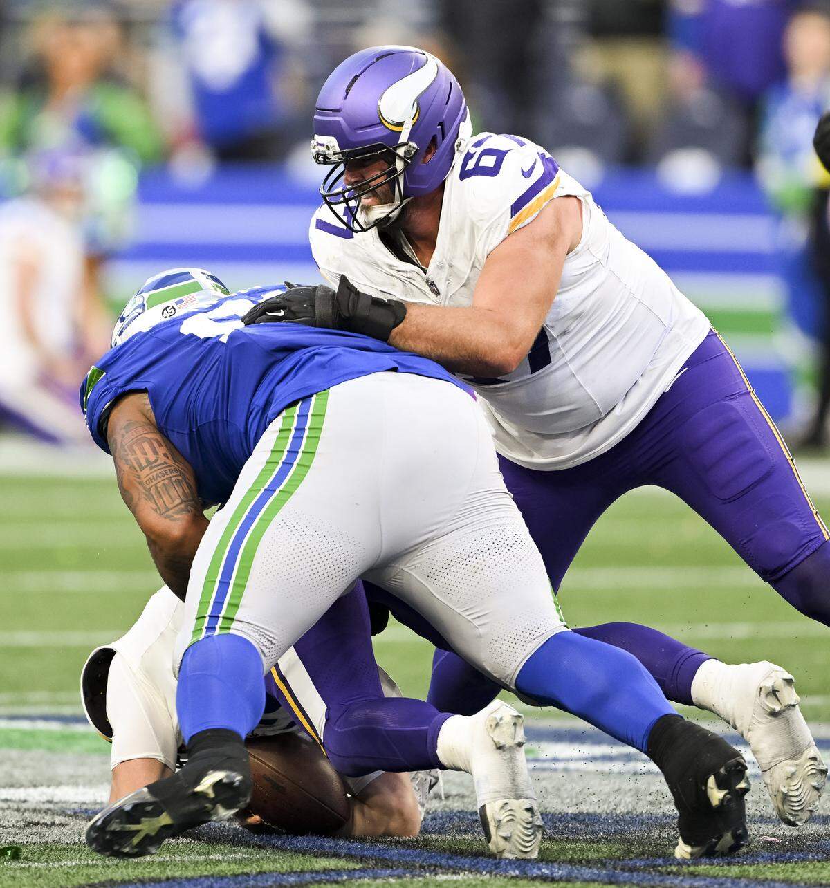 Seattle Seahawks defensive tackle Byron Murphy II (91) sacks Minnesota Vikings quarterback Max Brosmer (12) during the fourth quarter of the game at Lumen Field, on Sunday, Nov. 30, 2025, in Seattle.