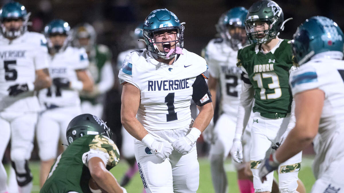 Auburn Riverside defensive back Andrew Shrader celebrates a big tackle during Friday night’s 3A NPSL championship game against the Auburn Trojans at Auburn Memorial Stadium in Auburn, Washington, on Oct. 27, 2023. Auburn Riverside won the game, 41-14.