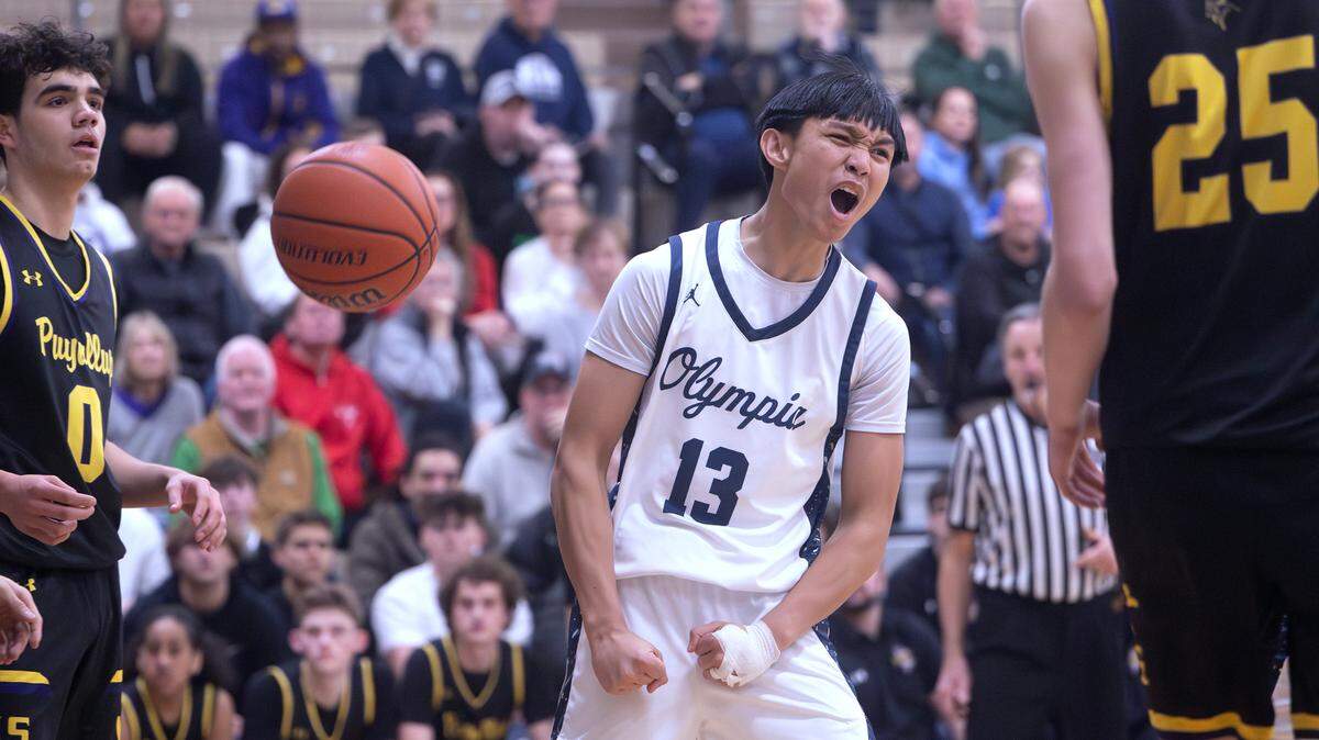 Olympia’s Julian Zapata celebrates a score and foul against Puyallup during Tuesday night’s 4A SPSL boys basketball game at Olympia High School in Olympia, Washington, on Jan. 14, 2025. Olympia won the game, 62-53.