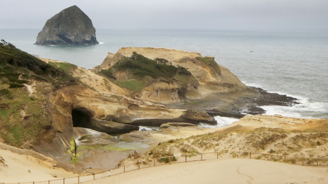 Two massive sinkholes merged along the coastline at the Cape Kiwanda State Natural Area in Oregon, officials said.