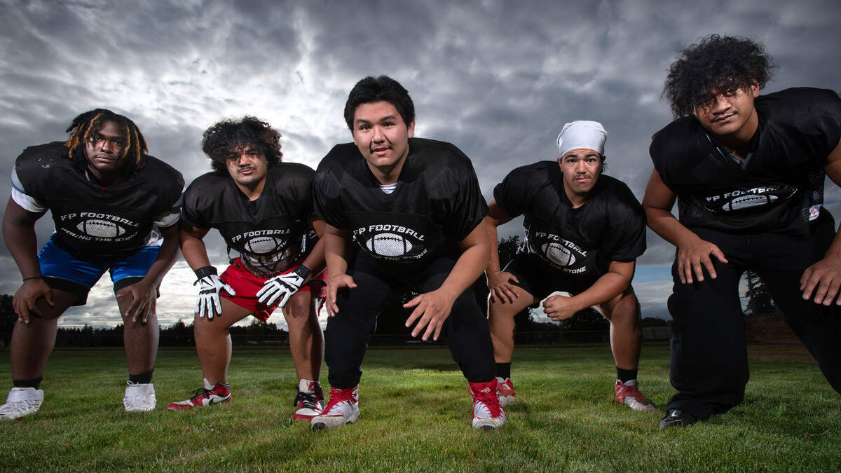 Franklin Pierce offensive linemen (from left) Jamal Abbott, Anthony Aloisio, Ian Swaney, Anton Aliosio and Tevita Aholelei are clearing space for the Cardinals old-fashioned Power T offense. They are shown at Franklin Pierce High School in Tacoma, Washington, on Tuesday, Oct. 8, 2024.