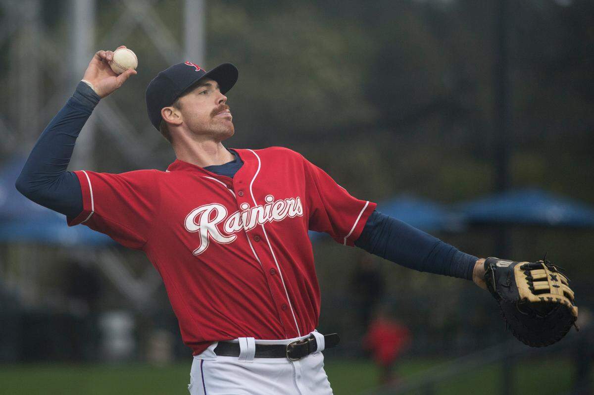 Tacoma Rainiers first baseman Zach Green throws a ball to the stands after an inning during a Triple-A baseball game against the Reno Aces on Sunday, May 15, 2022 at Cheney Stadium in Tacoma, Wash.