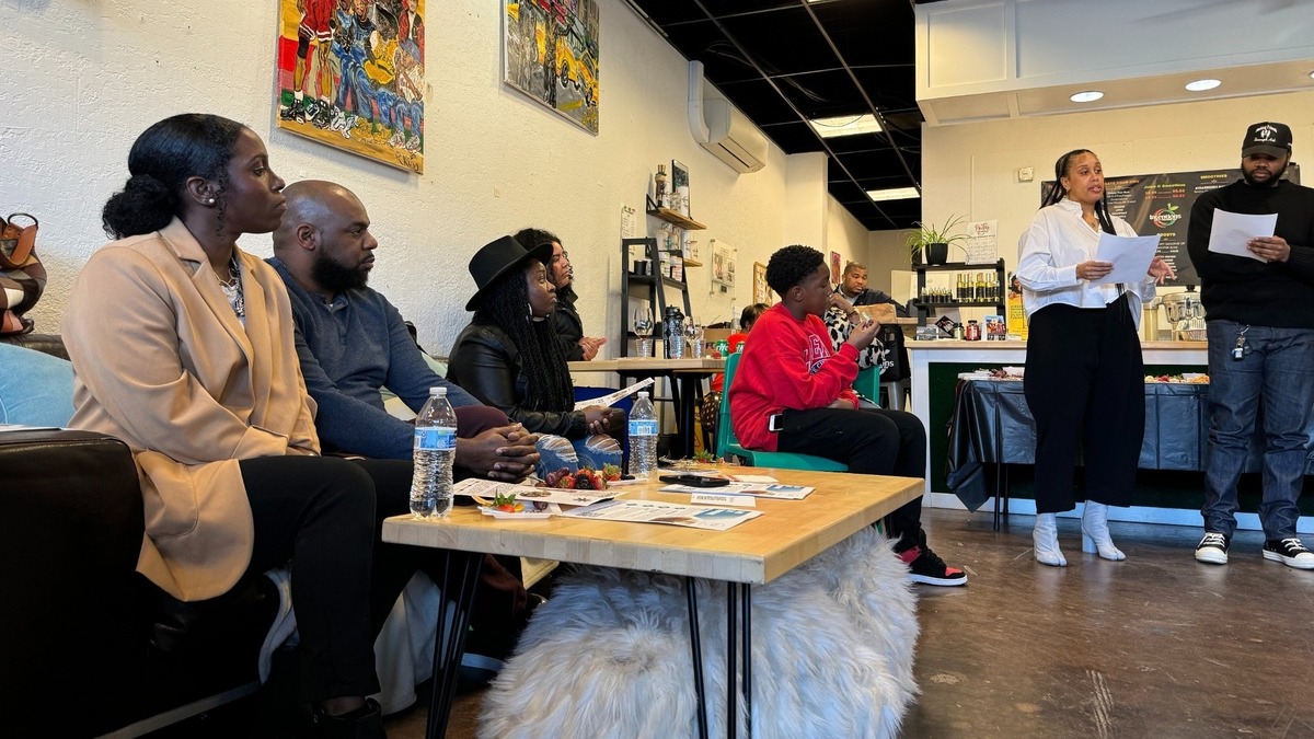 Tacoma Black Fund attendees listen to a presentation by Dierdre Patterson and Chase Williams of Concept, an experiential creative agency, during an event on Friday, March 28, 2024 at at Intentions Juice Bar.