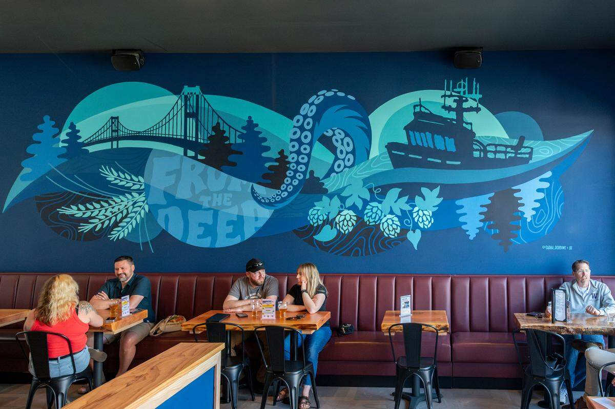 The taproom is breezy and big with ample seating, custom woodwork and a nautical mural that highlights the brewery’s roots at Narrows Marina. Beer drinkers checked it out on Wednesday, July 2.