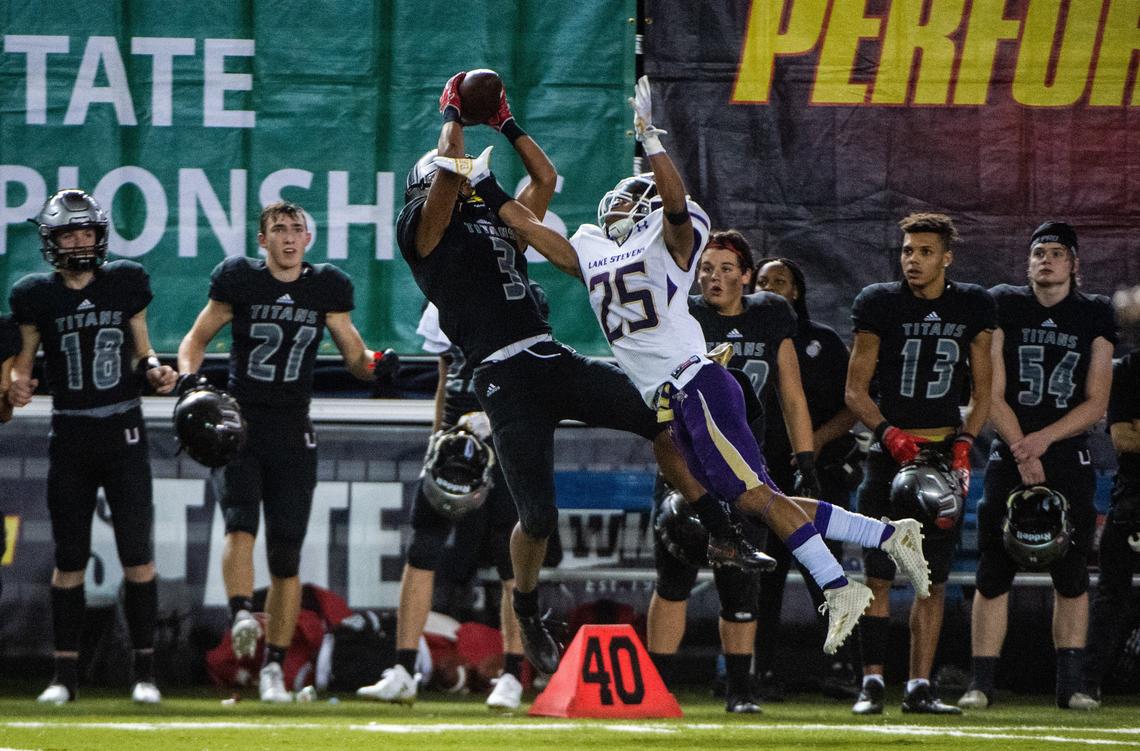 Union’s Darien Chase (3) makes a catch over Lake Stevens’ Kasen Kinchen (25) in the second quarter. Union played Lake Stevens in the WIAA 4A football state championship game at the Tacoma Dome in Tacoma, Wash., on Saturday, Dec. 1, 2018.
