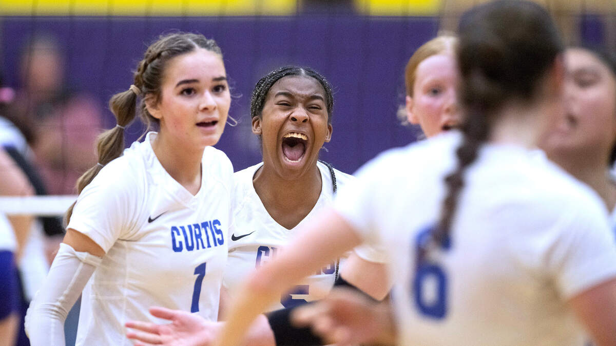 Curtis’ Avery Cukjati (1) and Mia Nelson celebrate a winning point during Monday night’s 4A SPSL volleyball match against the Puyallup Vikings at Puyallup High School in Puyallup, Washington, on Oct. 16, 2023. Puyallup won the match in four sets.
