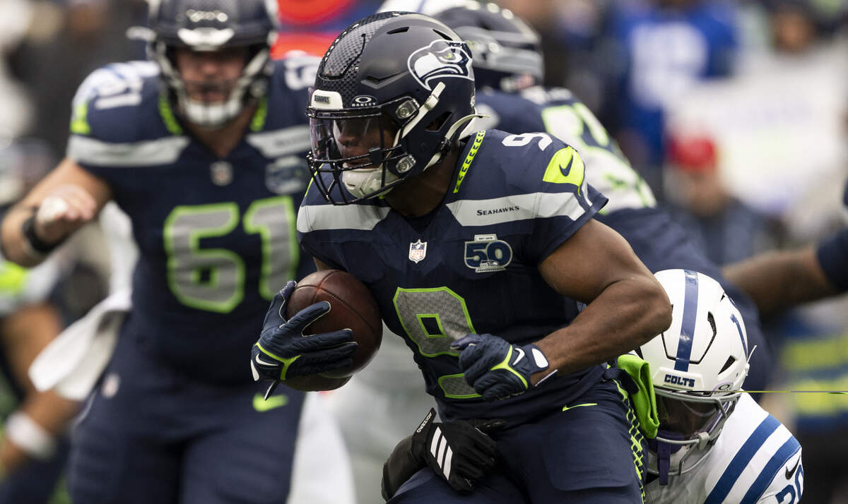 Seattle Seahawks running back Kenneth Walker III (9) carries the ball during the first quarter of the game against the Indianapolis Colts at Lumen Field, on Sunday, Dec. 14, 2025, in Seattle.
