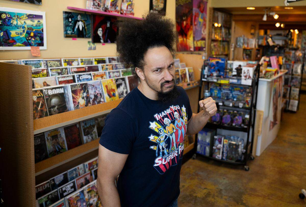ETHAN H.D., owner and proprietary, Destiny City Comics poses for a portrait, on Wednesday, Feb. 12, 2025, in Tacoma, Wash.