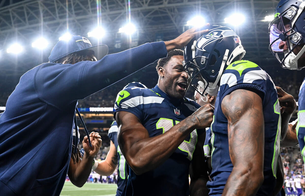 Seattle Seahawks wide receiver DK Metcalf (14) congratulates wide receiver Matt Landers (17) on a scoring a touchdown during the fourth quarter of the preseason game at Lumen Field, Thursday, Aug. 10, 2023, in Seattle, Wash.