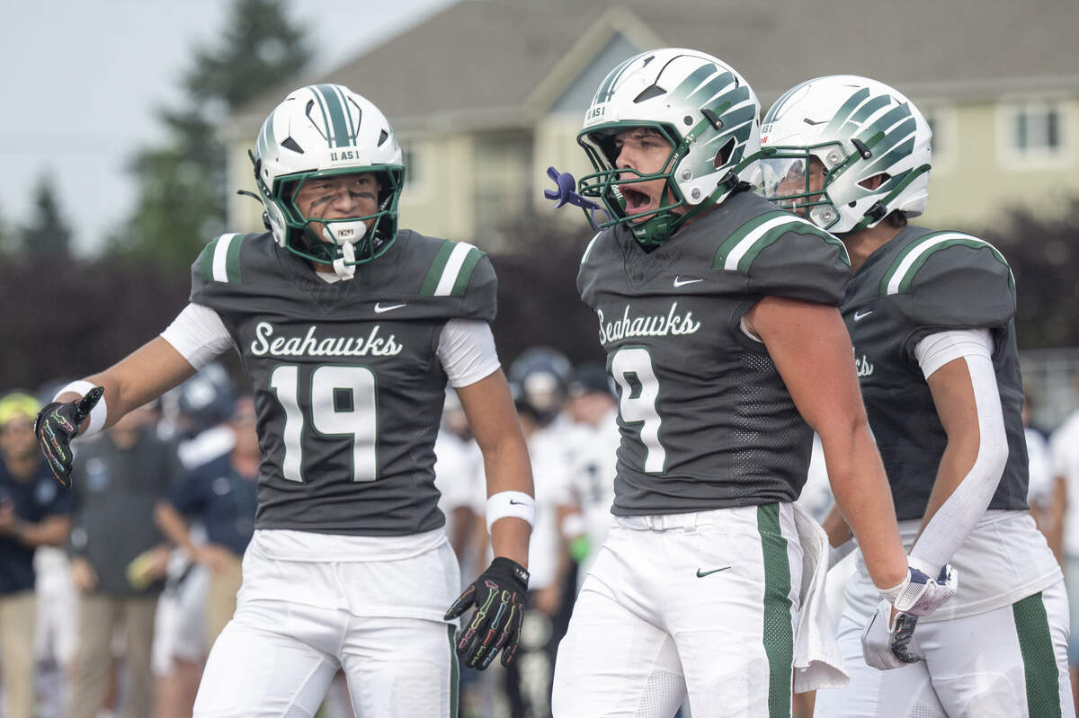 Peninsula senior running back Jacob Martin (9) celebrates his touchdown against Gig Harbor during the Fish Bowl matchup on Saturday, Sept. 6, 2025, at Mount Tahoma High School in Tacoma, Wash.