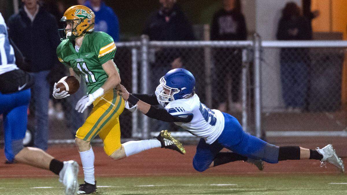 Tumwater wide receiver Luke Reid breaks away from Sedro-Woolley linebacker Ty Peterson for a touchdown reception during Friday night’s 2A state football playoff game at Tumwater District Stadium in Tumwater, Washington, Nov. 11, 2022. Sedro-Woolley won the game, 30-22.