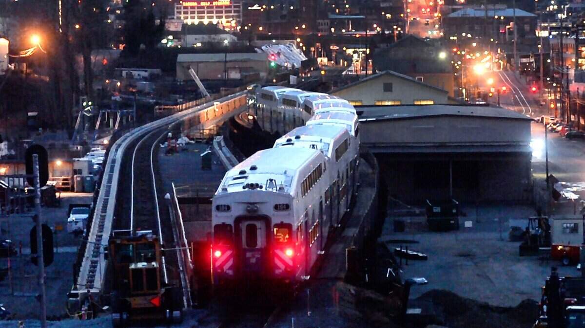 A southbound Sounder train navigates the old trestle adjacent to the new one under construction near Tacoma Dome station in Februaru 2017. A $10 million federal grant was used to help pay for the $161 million project.