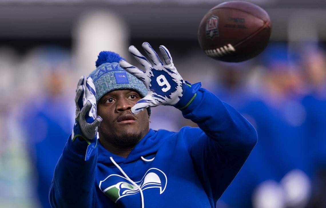 Seattle Seahawks running back Kenneth Walker III (9) warms up before the game against the Tampa Bay Buccaneers at Lumen Field, on Sunday, Oct. 5, 2025, in Seattle.