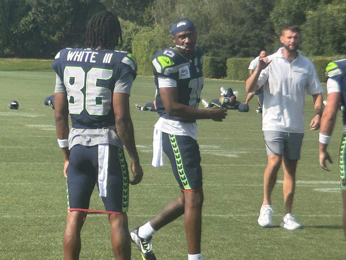 Tory Horton (15) talks to fellow rookie wide receiver and Seattle draft pick Ricky White during the eighth practice of Seattle Seahawks NFL training camp Thursday, July 31, 2025 at the Virginia Mason Athletic Center in Renton.