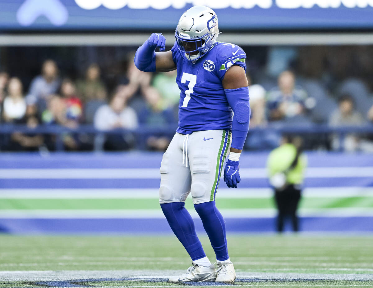 Seattle Seahawks linebacker Uchenna Nwosu (7) reacts to a sack of Tampa Bay Buccaneers quarterback Baker Mayfield (6) during the fourth quarter of the game at Lumen Field, on Sunday, Oct. 5, 2025, in Seattle.