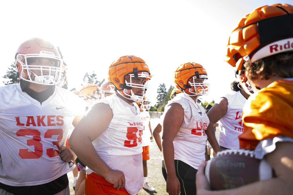 Lakes players huddle during a football practice at Lakes High School on Wednesday, Aug. 20, 2025, in Lakewood, Wash..