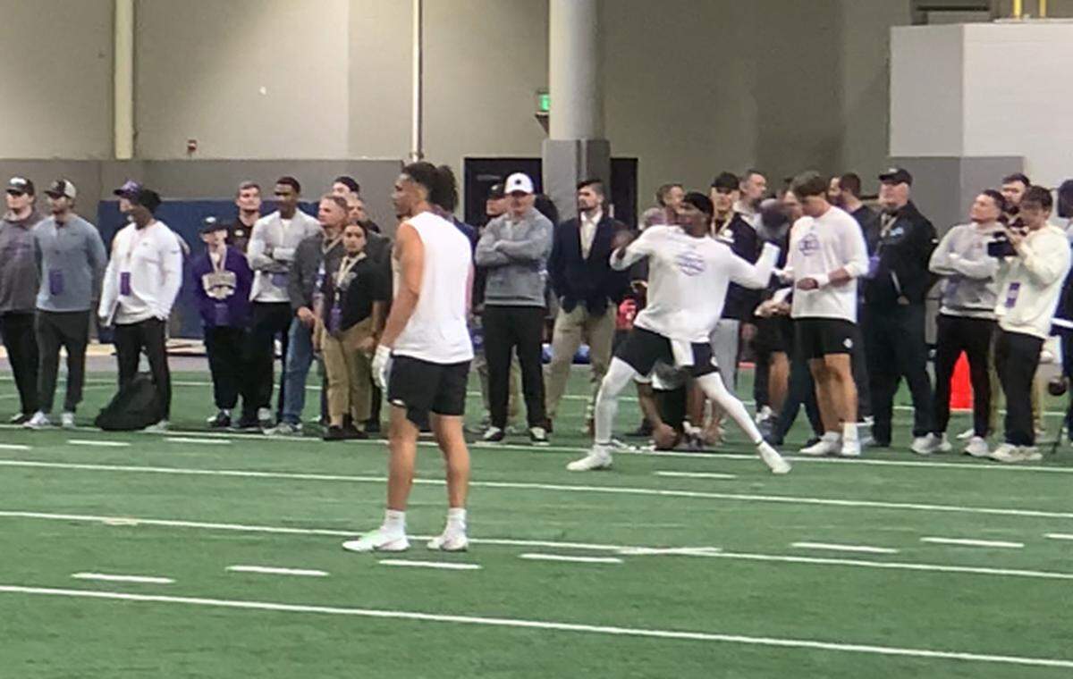 Michael Penix Jr. throws at the University of Washington Pro Day in front of Seahawks general manager John Schneider and personnel from at least 30 of the NFL’s 32 teams on March 28, 2024, at UW’s Dempsey Indoor practice facility. Penix is expected to be a high pick in the 2024 NFL draft.