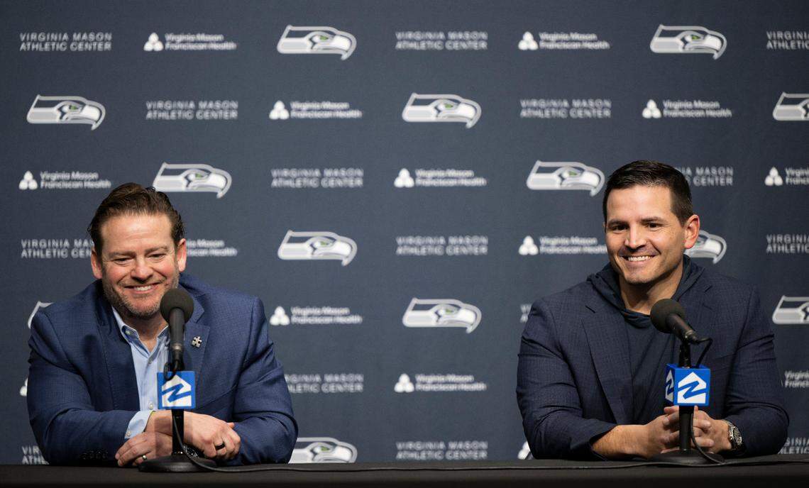 Seahawks general manager John Schneider and new head coach Mike Macdonald answer questions during Macdonald’s first press conference as head coach at Virginia Mason Athletic Center on Thursday, Feb. 1, 2024, in Renton, Washington.