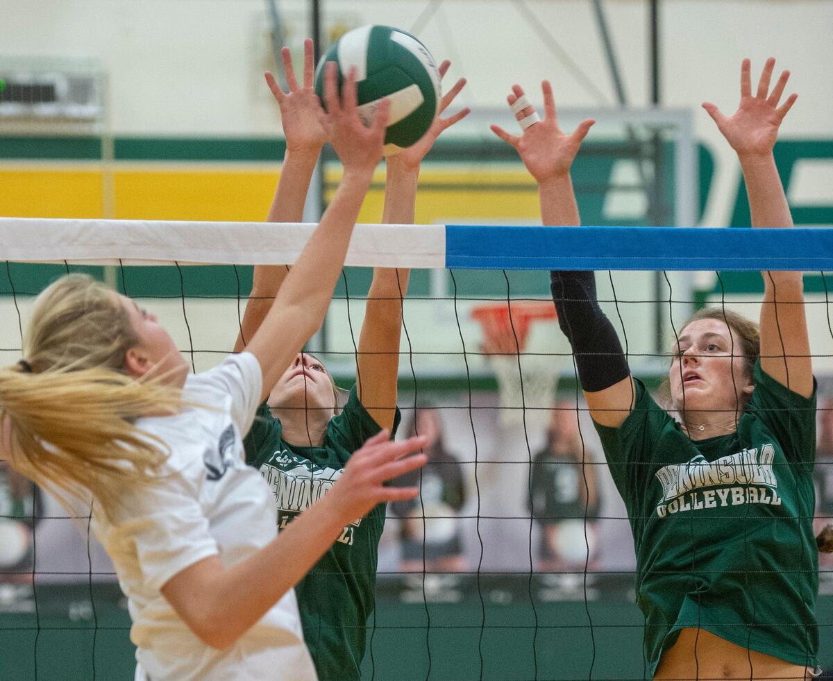Maeve, right, and Langley Griffin team up to defend during a Seahawks practice at Peninsula High School in Gig Harbor on Monday, Sept. 23, 2019.