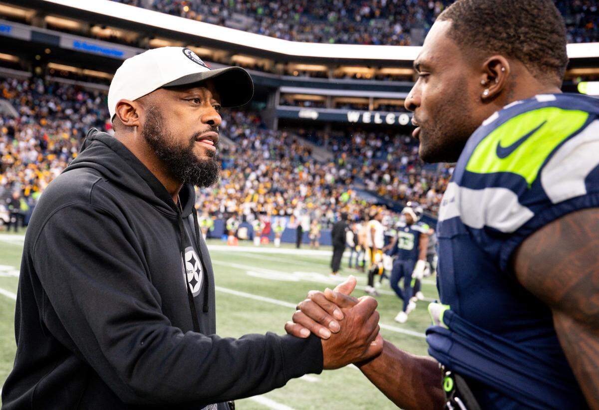 Pittsburgh Steelers head coach Mike Tomlin shakes hands with Seattle Seahawks wide receiver DK Metcalf (14) after the Steelers 30-23 victory against the Seattle Seahawks at Lumen Field, on Sunday, Dec. 31, 2023, in Seattle, Wash.