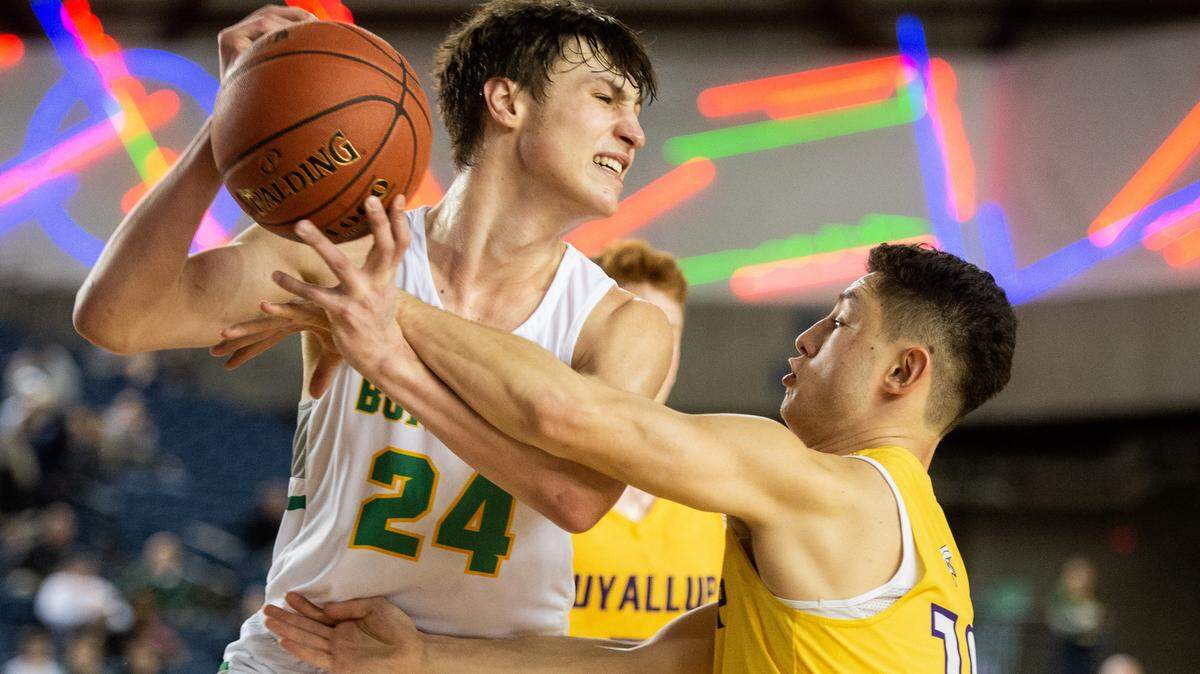 Richland’s Colten Northrop (24) pulls a rebound away from Puyallup’s Jacob Holcomb (10) in the fourth quarter. Puyallup played Richland in a basketball game at the Hardwood Classic State Basketball Tournament at the Tacoma Dome in Tacoma, Wash., on Saturday, March 2, 2019.