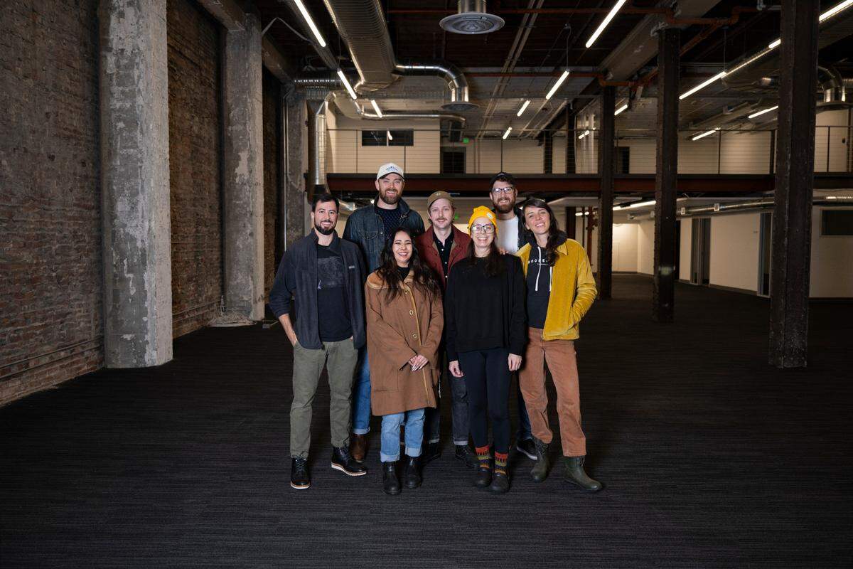 Back row from left: co-owners Jon Green and Abe Fox, bar manager Alex King, FOH lead Michael Reid; front row: assistant general manager Brookelynn Hiatt, executive chef Lili Mancini, general manager Erin Conners Bergfield at the new location of Wooden City in Tacoma, on Wednesday, Oct. 30, 2024.