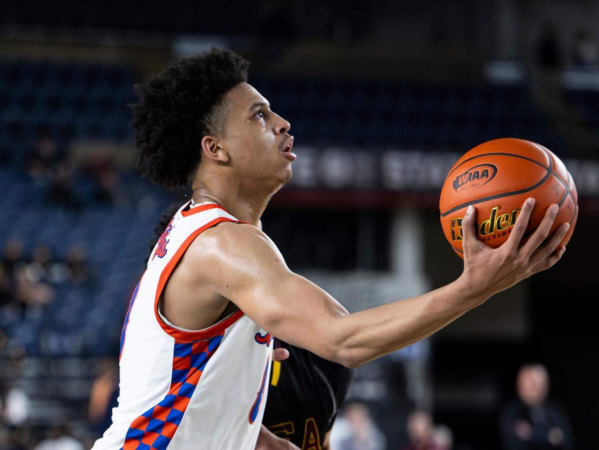 Rainier Beach’s Kaden Powers (0) hits a lay-up against O’Dea during the semifinals game of the Class 4A state tournament at the Tacoma Dome, on Friday, March 1, 2024, in Tacoma, Wash.
