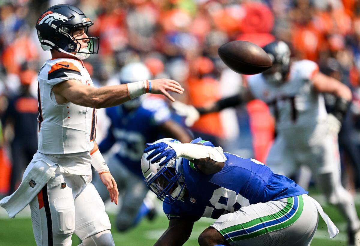 Seattle Seahawks linebacker Derick Hall (58) pressures Denver Broncos quarterback Bo Nix (10) during the second quarter of the game at Lumen Field, on Sunday, Sept. 8, 2024, in Seattle, Wash.