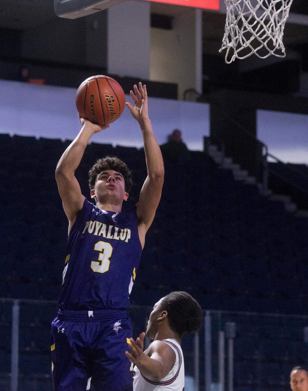 Puyallup High School guard Isaiah Sonntag puts up a shot during the fourth quarter of a basketball game against Kentlake at the 2023 King Showcase on Monday, Jan. 16, 2023 at the ShoWare Center in Kent, Wash.