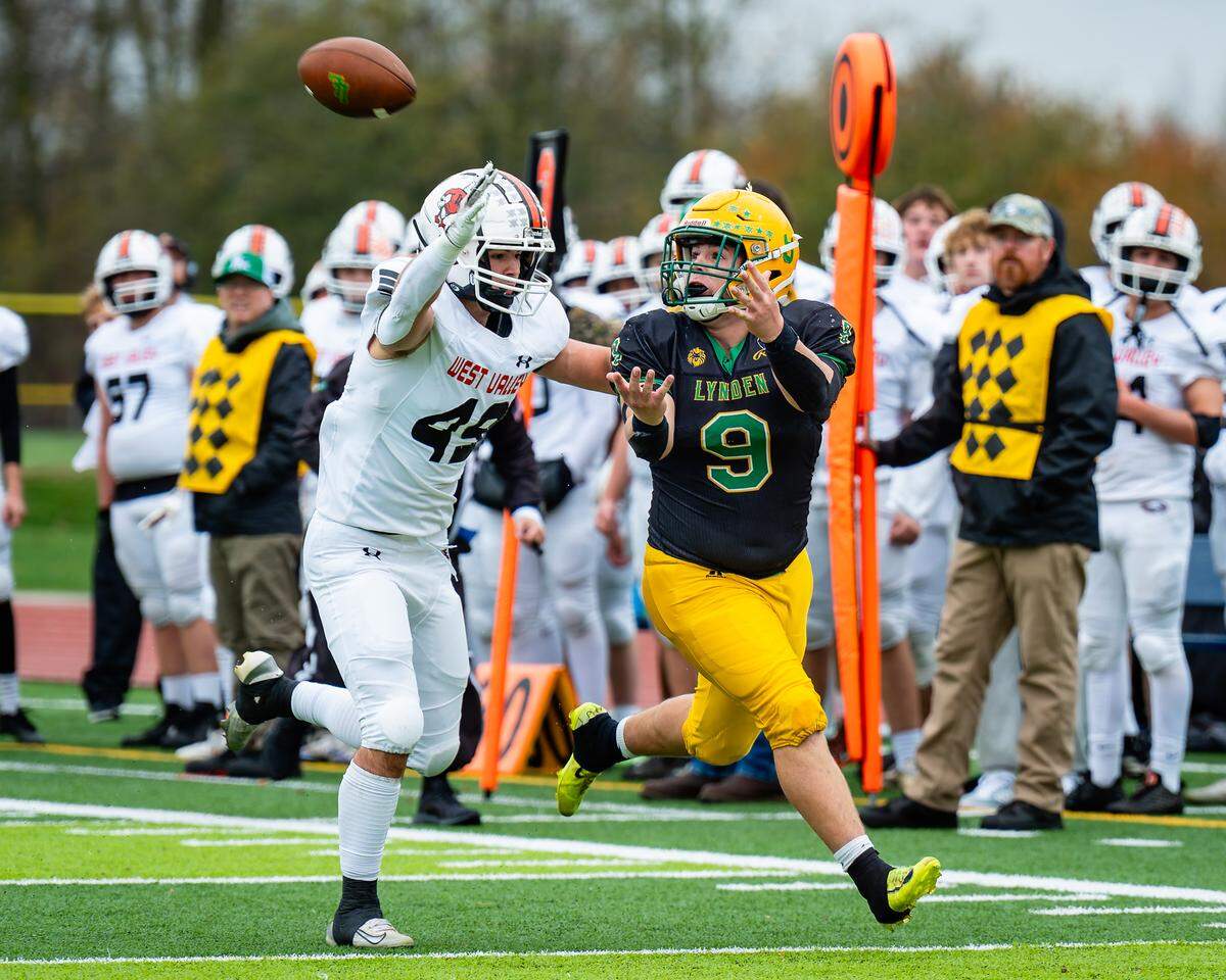 Lynden’s Malachi Koenen (9) looks for a pass guarded by West Valley's Connor Dunfield in the 2A state football opening round at Ferndale High School on Nov. 15, 2025, in Ferndale, Wash.