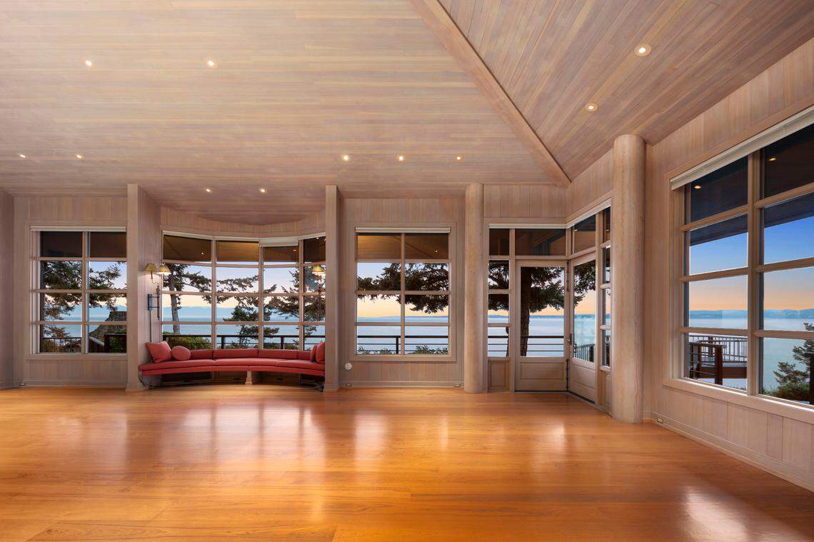 The interior spans nearly 10,000 square feet with water views.