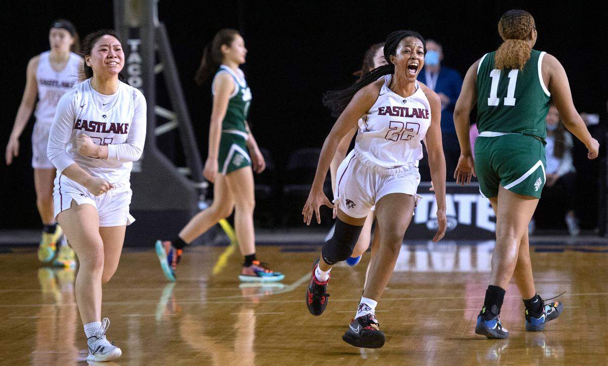 Eastlake’s McKayla Matsuoka (left) and Kaylia Jackson celebrate as time expires in the Wolves’ 44-43 victory over Emerald Ridge Jaguars in Thursday morning’s quarterfinal game of the WIAA 3A Girls Basketball State Championships tournament in the Tacoma Dome in Tacoma, Washington, on Thursday, March 3, 2022.