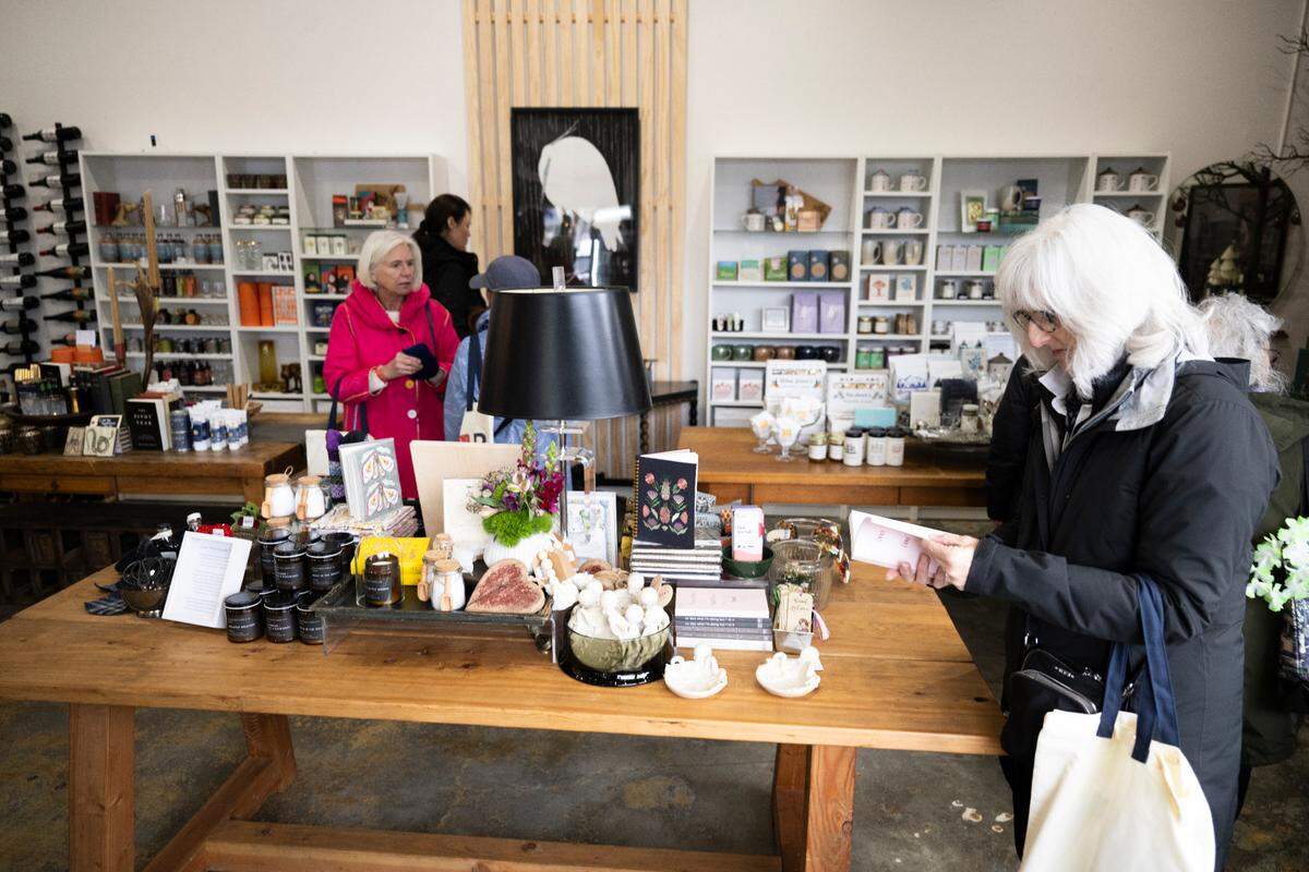 Customers peruse unique gifts during the soft opening at Curated on Nov. 14 in Gig Harbor.