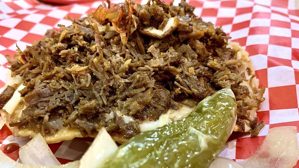 Birria-style beef is the main attraction at Birrieria Tijuana, here in the Vampiro, similar to a tostada but not nearly as crunchy of a shell. Kristine Sherred/The News Tribune