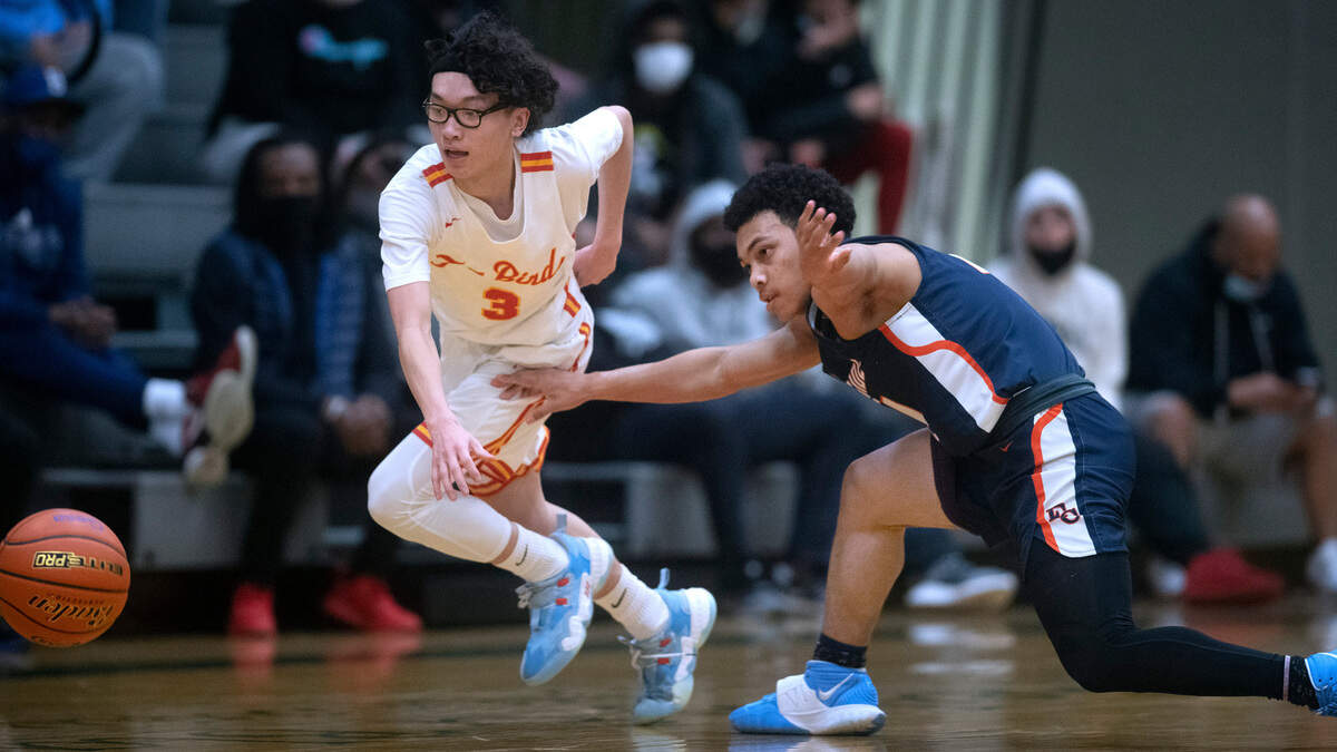 Mount Tahoma’s Ryan Tran steals the ball from Eastside Catholic’s Kayden Lamebull-Ingram during Friday night’s boys basketball regional playoff game at Foss High School Tacoma, Washington, on Feb. 25, 2022. Eastside Christian won the game, 68-51.