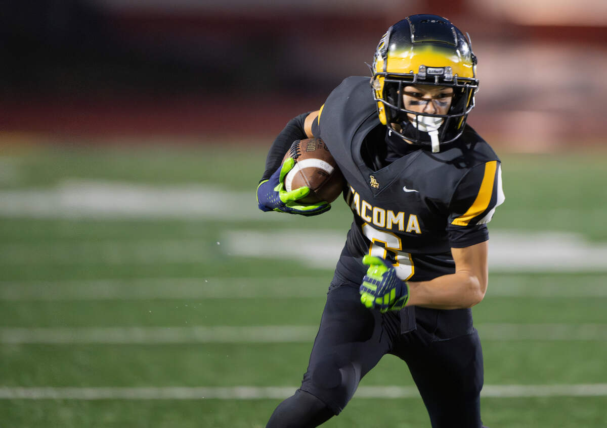 Lincoln wide receiver Kanoa Teplasy (6) picks up yards against Yelm during the first half of the game at Lincoln High School, on Friday, Sept. 13, 2024, in Tacoma, Wash.