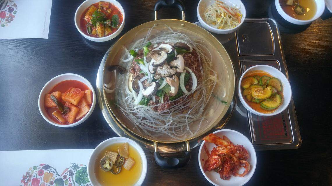 Tabletop barbecue at Hanilkwan Bulgogi Restaurant in Lakewood includes meat and lots of vegetables. Diners can grill their food on a tabletop grill built into the tables.