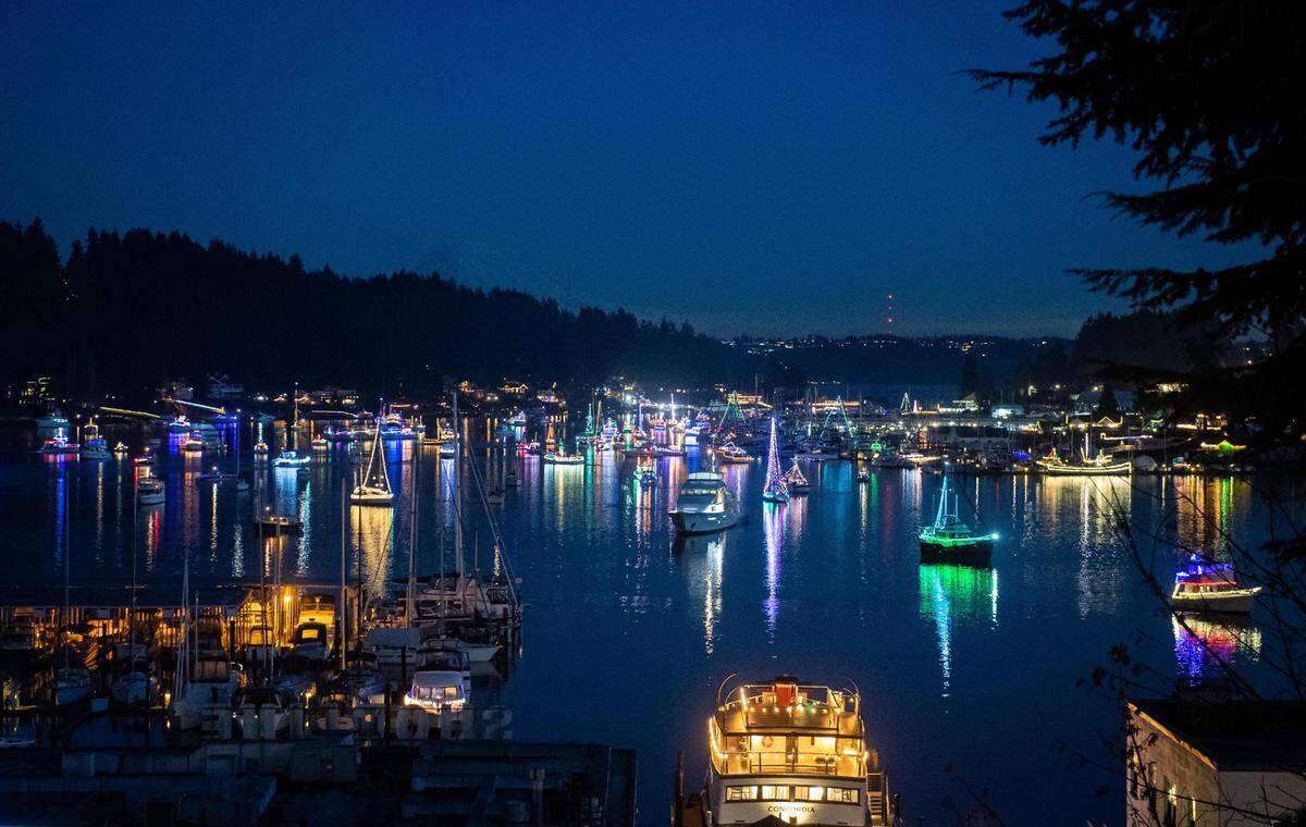 Decorated boats fill the harbor during the Lighted Boat Parade in Gig Harbor, Wash., on Saturday, Dec. 12, 2020.