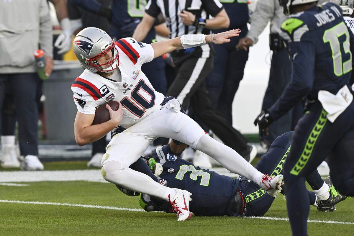 New England Patriots quarterback Drake Maye (10) is tackled by Seattle Seahawks linebacker Boye Mafe (53) during Super Bowl LX at Levi’s Stadium in Santa Clara on Sunday, Feb. 8, 2026.