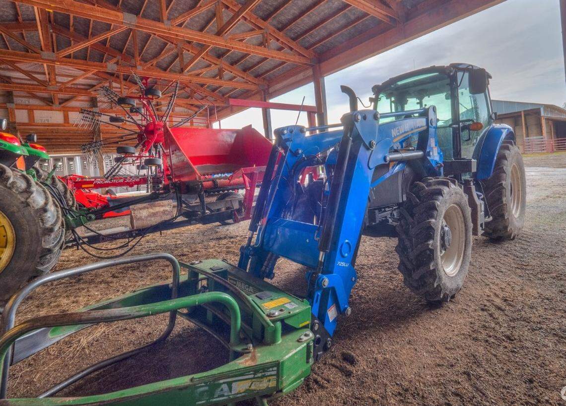 The sale includes all the necessary equipment to run a ranch and hay operation including three tractors, a baler and chutes.