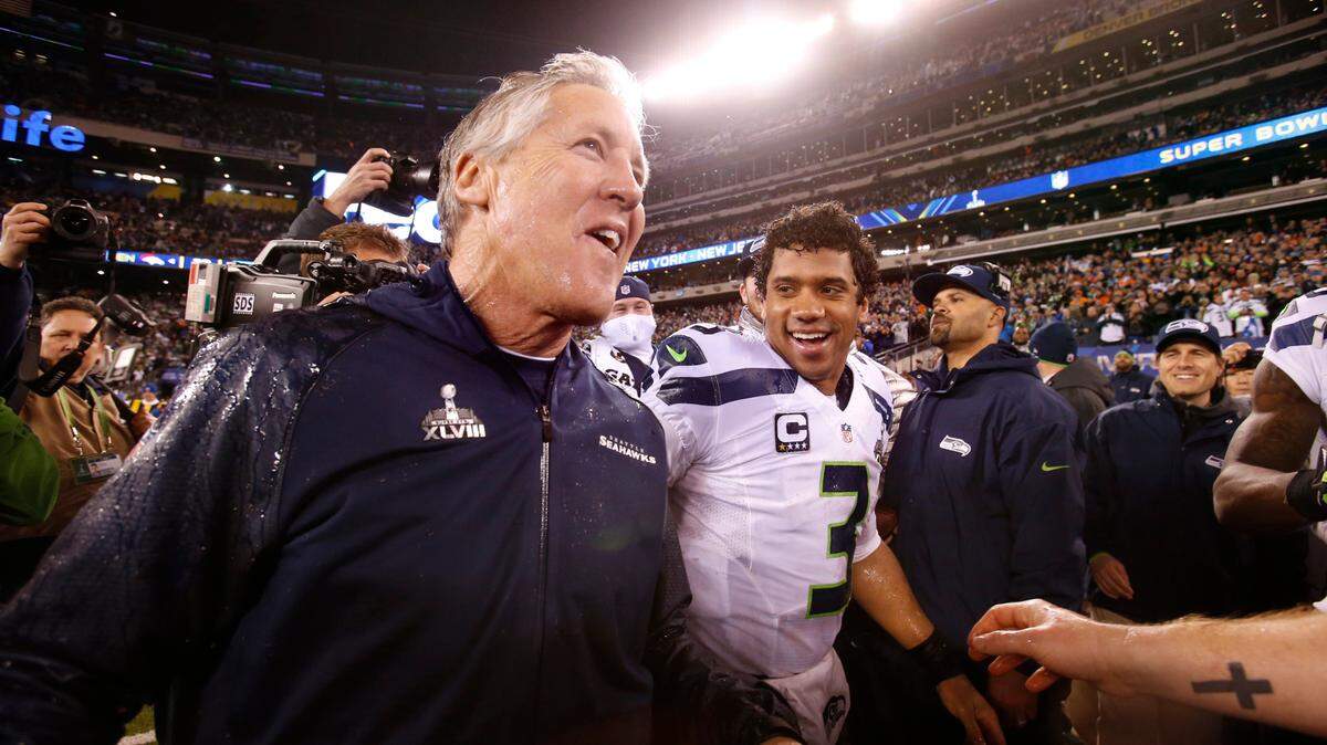 Seattle head coach Pete Carroll and quarterback Russell Wilson celebrate in the final seconds of the Seahawks 43-8 victory over the Denver Broncos in Super Bowl XLVII at MetLife Stadium in East Rutherford, NJ on Sunday, Feb. 2, 2014.