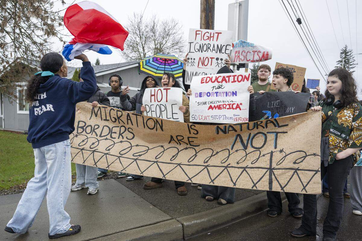 Spanaway Lake High School students pause to chant as they march in protest of ICE on Thursday, Jan. 29, 2026, in Spanaway, Wash.