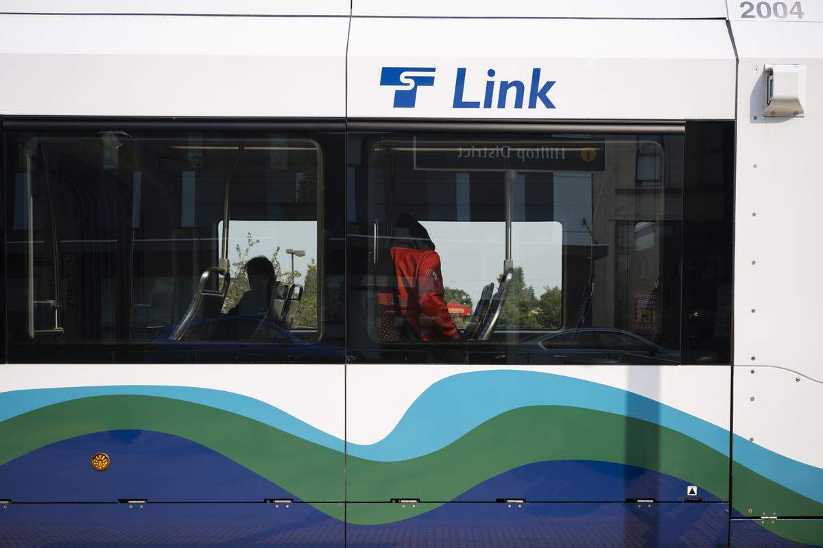 Riders exit the Link at the Hilltop stop, on Thursday, Sept. 4, 2025, in Tacoma, Wash.